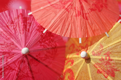 Paper parasols in pink  orange and yellow