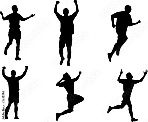 silhouettes celebrating scoring goal in soccer match 