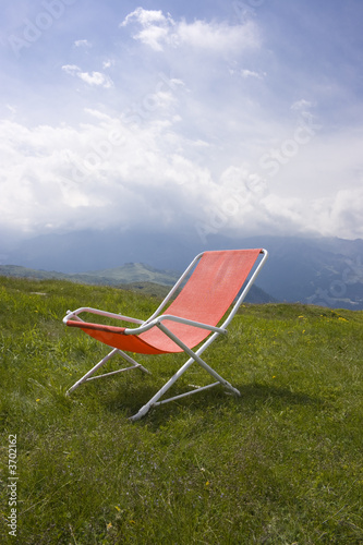 Chaise longue with a beautiful alpine scenic