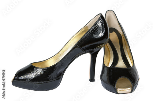 Female shoes from a brilliant leather on a white background