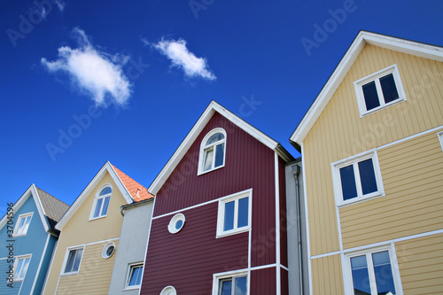 Four colorful houses with blue sky