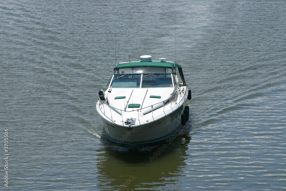 Sport boat going out to open waters Sport boat going out to open waters