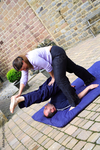 Spine stretch as part of a Thai body massage.