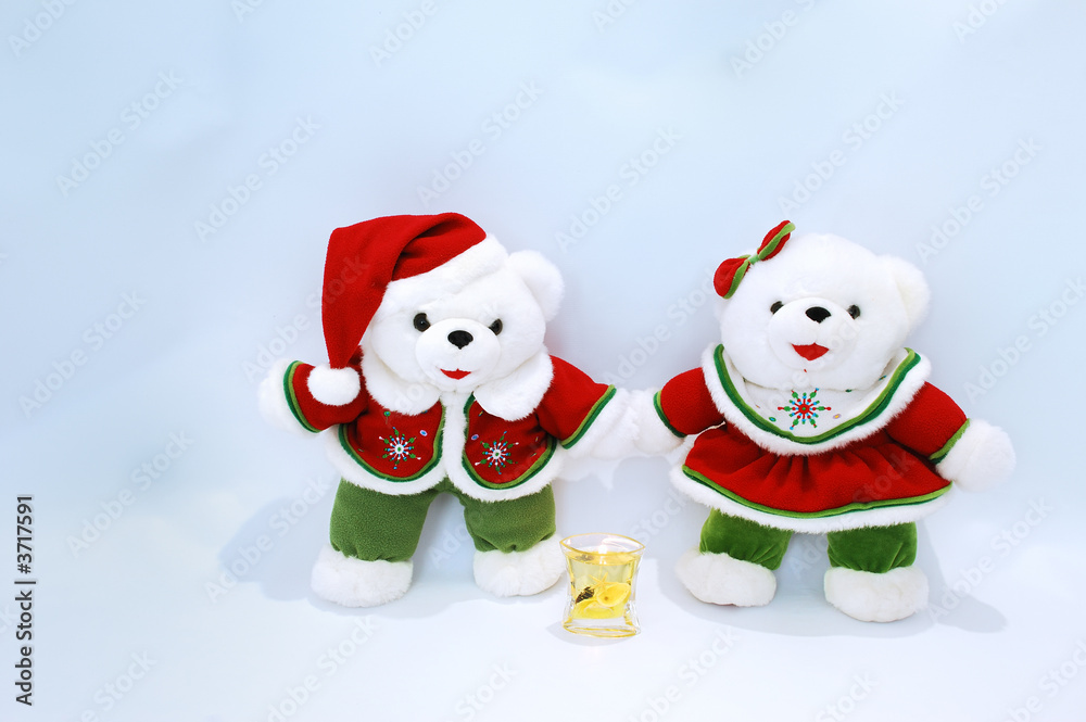 Christmas bears with candle  on light blue background