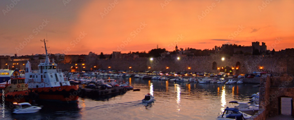 old city harbour of Rhodes greece at sunset