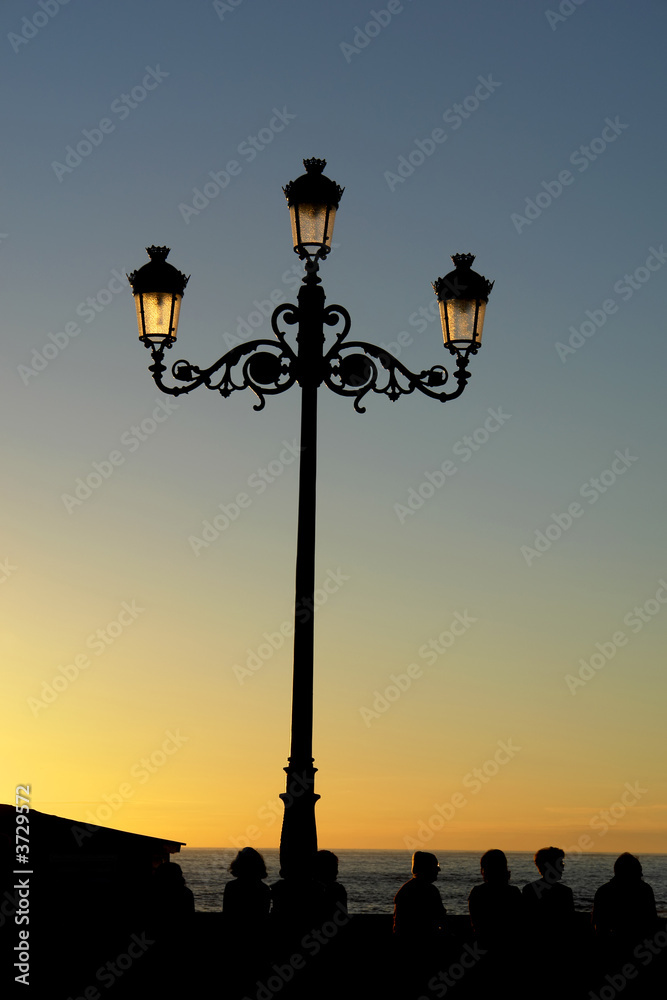 street light at sunset in the coast