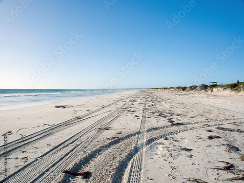 tire tracks on beach sand