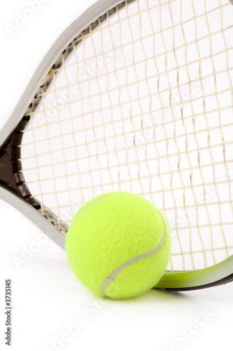 a tennis ball and racket © Feng Yu