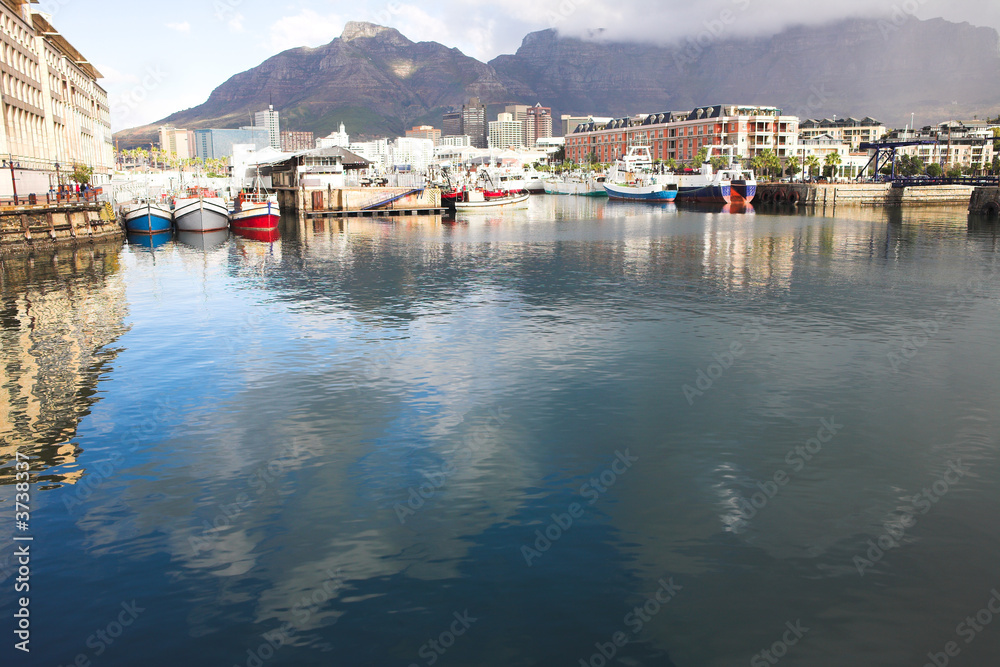Cape Town waterfront harbor with three boats 