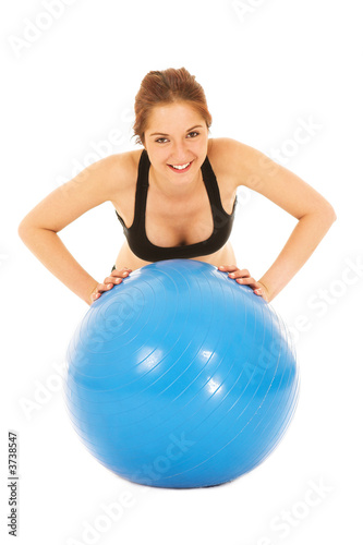 Isolated young adult Caucasian woman doing push-ups 