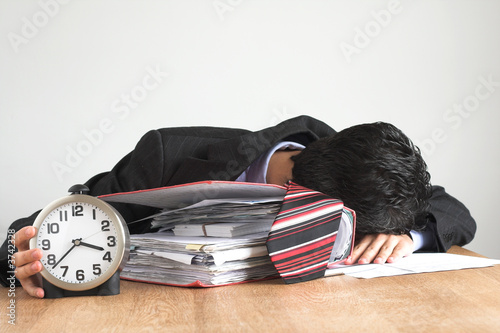  exhausted businessman working hard photo