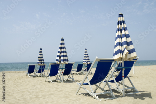 The beach-chairs are ready tot take a sunbath photo