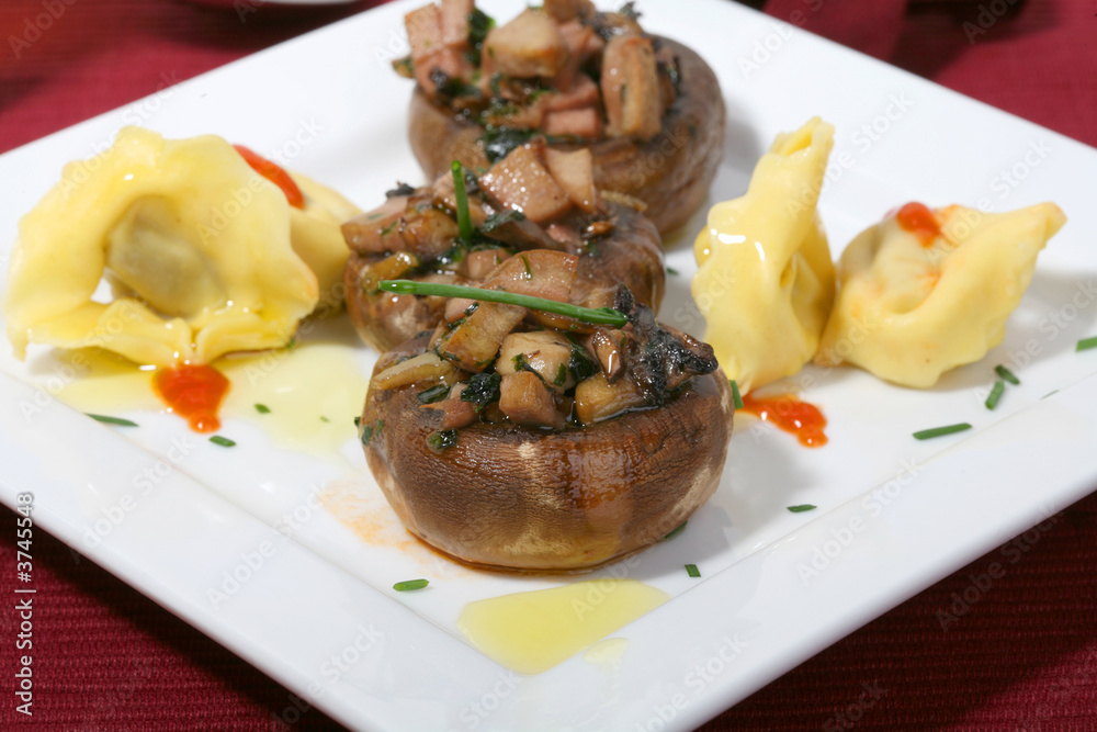 mushrooms filled with garlic sauce and fresh onions