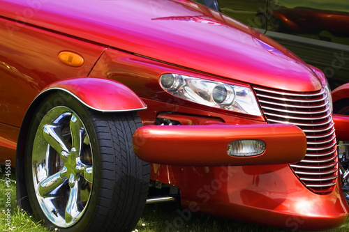 A close up photograph of a brightly coloured hot rod car