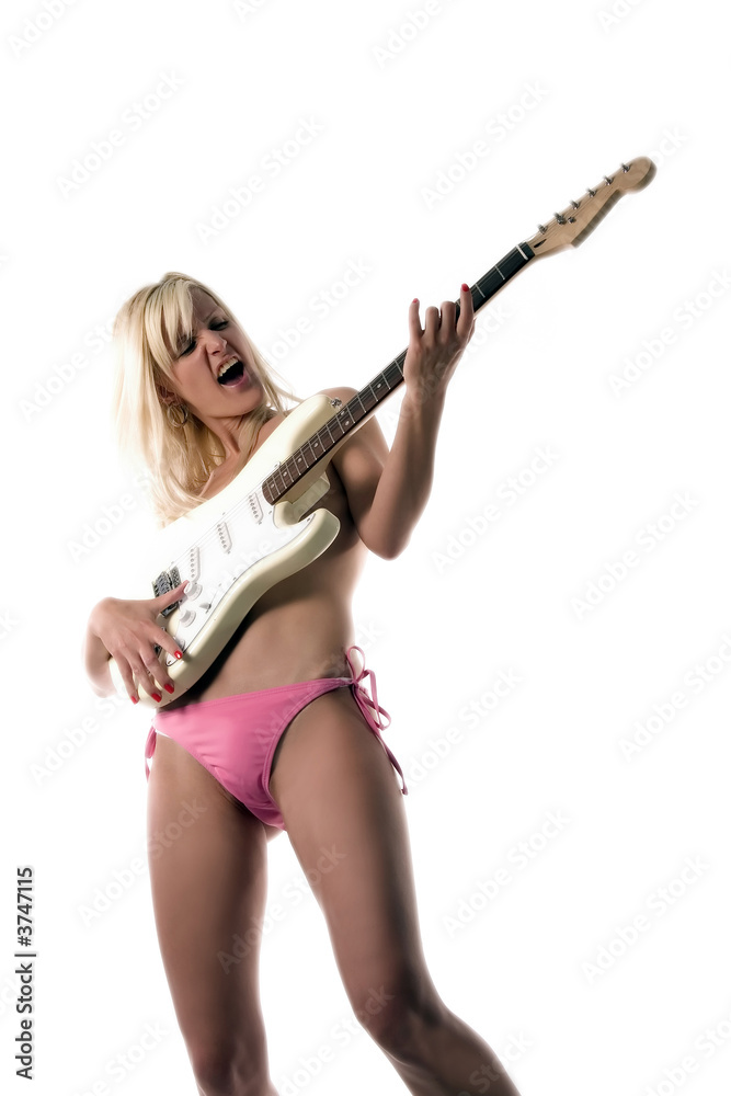 a blond girl is playing guitar