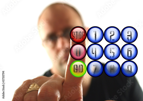 Man Pressing the Red Stop Button.