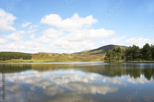 Fototapeta Naklejka Na Ścianę i Meble -  A peaceful inland Scottish Loch in Highland Perthshire