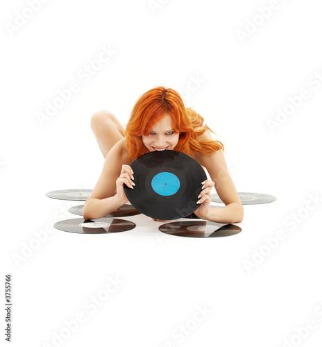 playful redhead with vinyl records over white photo