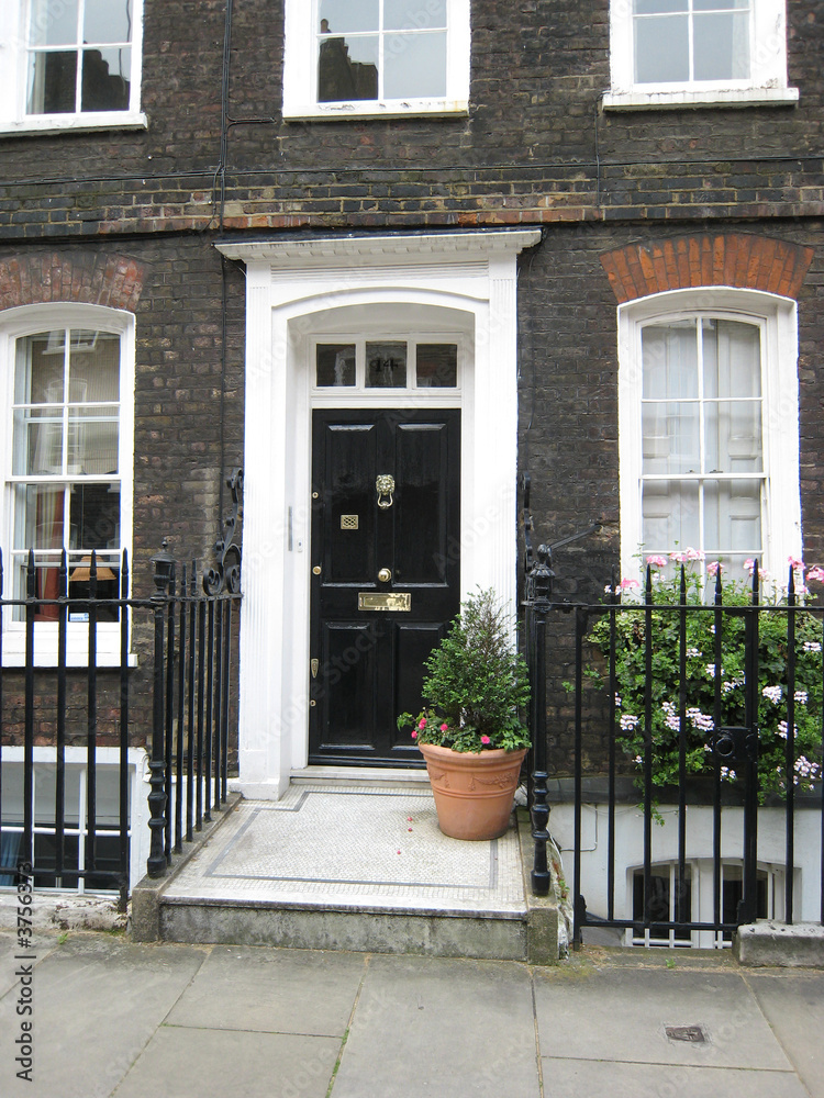 A Row of Brick Buildings with Black Doors on a Street in London Stock Image  - Image of architecture, english: 189002149
