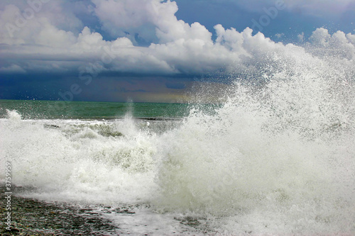 Storm on the sea with high waves under the sky