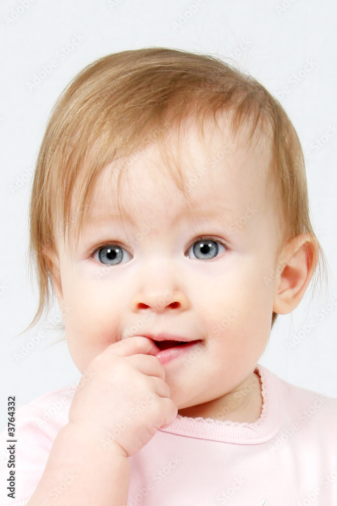 Little Girl with finger in her mouth, taken closeup Little Girl with finger in her mouth, taken closeup