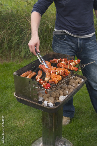 turning meat on barbecue