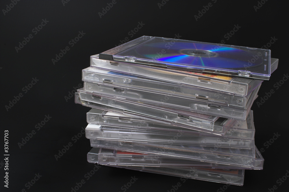 A stack of compact discs with recorded music. A stack of compact discs with recorded music.