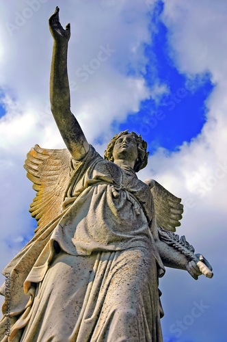 angelic victory statue on the blue sky background © Jitloac