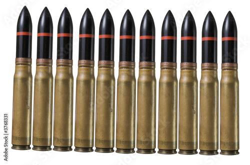 Many big bullets in pistol bullet formation. War concept photo
