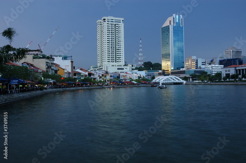 Sunset  modern building and river in the city