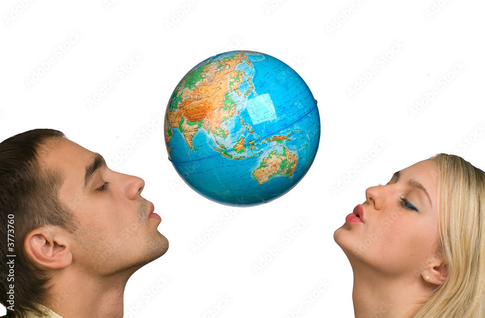 The guy and the girl hold the globe on a white background The guy and the girl hold the globe on a white background