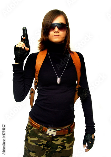 Girl in camouflage with gun. Isolated on white. photo