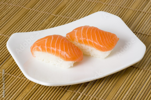 Japanese food - Salmon nigiri on a plate..