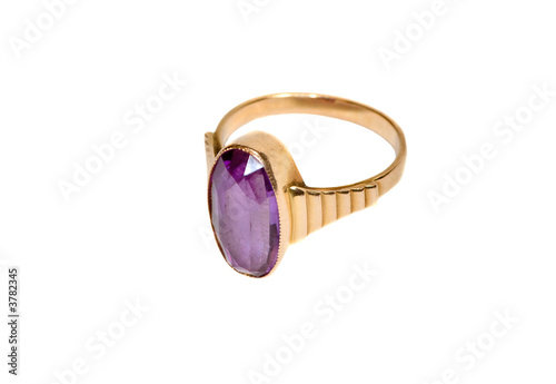 Beautiful gold ring with alexandrite on the white background photo