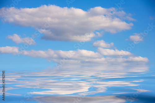 pretty blue sky reflected in the water