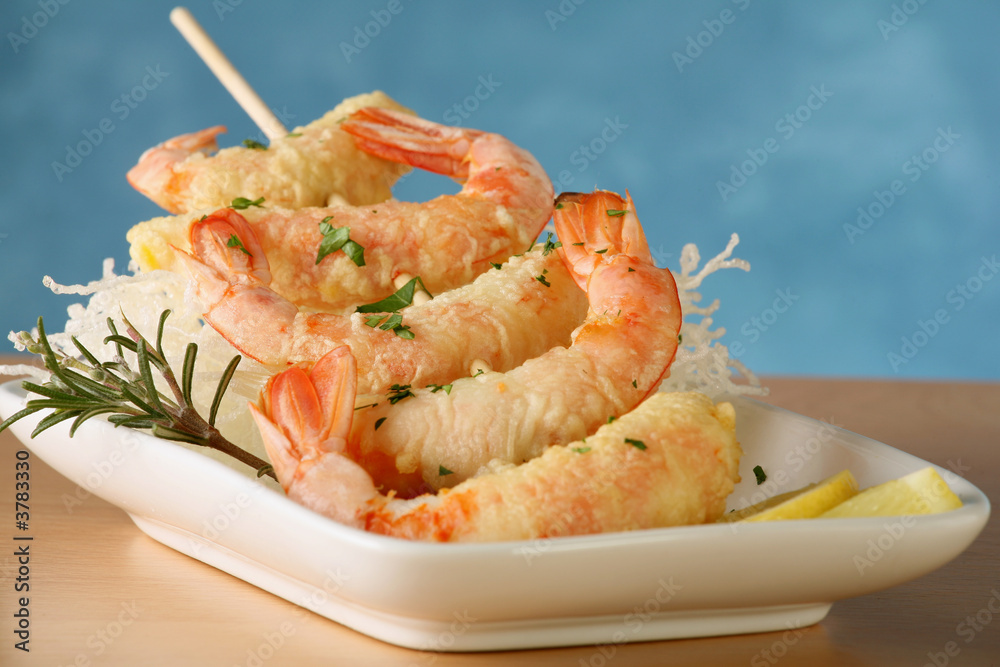 Tempura Jumbo Shrimp skewer on table with fried rice pasta Tempura Jumbo Shrimp skewer on table with fried rice pasta