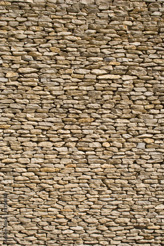 the detail of a wall made of stones