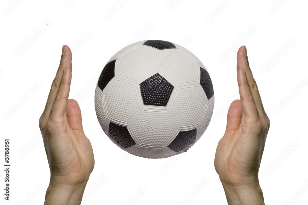 two hands holding a soccer ball two hands holding a soccer ball