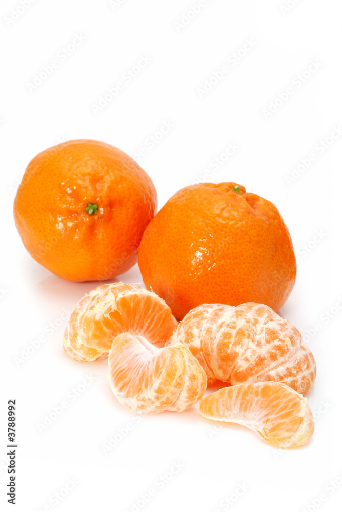 Mandarins, whole and peeled, isolated on white. Mandarins, whole and peeled, isolated on white.