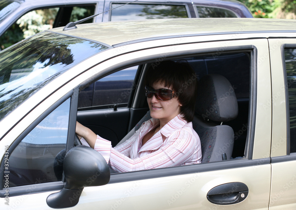 girl operates the automobile