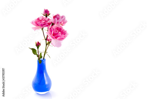 Little blue vase with pink roses