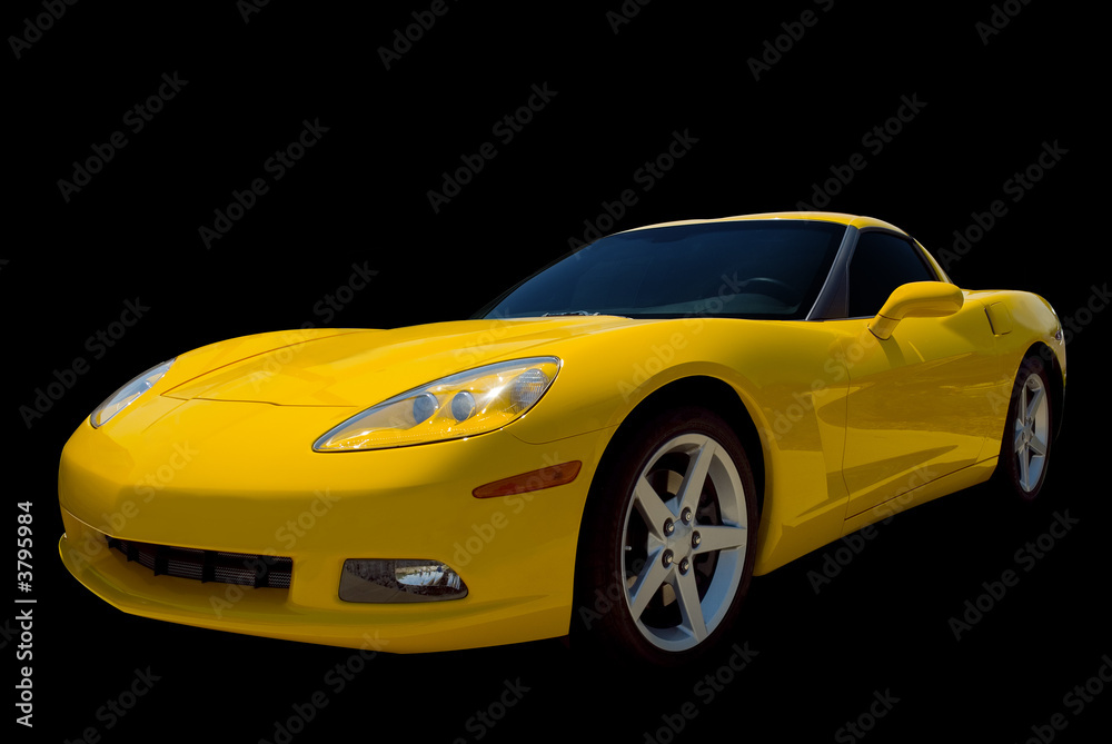 A yellow sports car isolated on a black background.