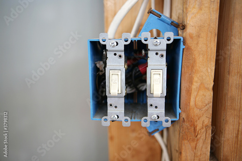 A two gang, 120 volt single pole electrical switch box 