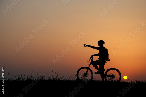 mountain biker silhouette in sunrise © Imre Forgo