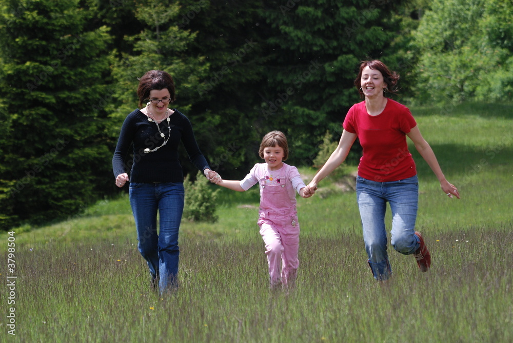 Obraz premium happy girls running in nature