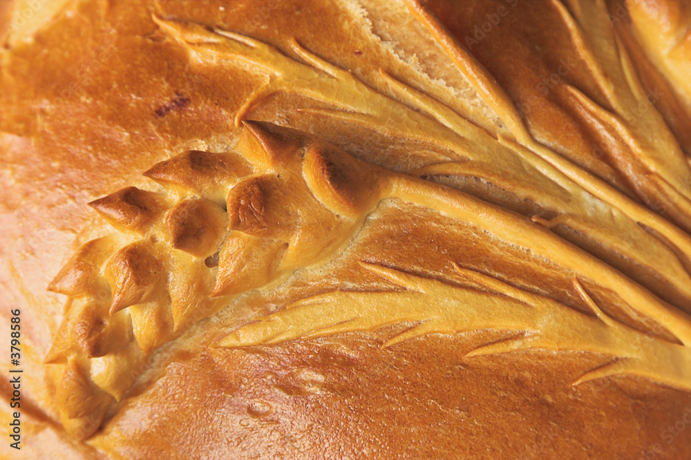 Close-up of a fresh loaf, traditional bread. Close-up of a fresh loaf, traditional bread.
