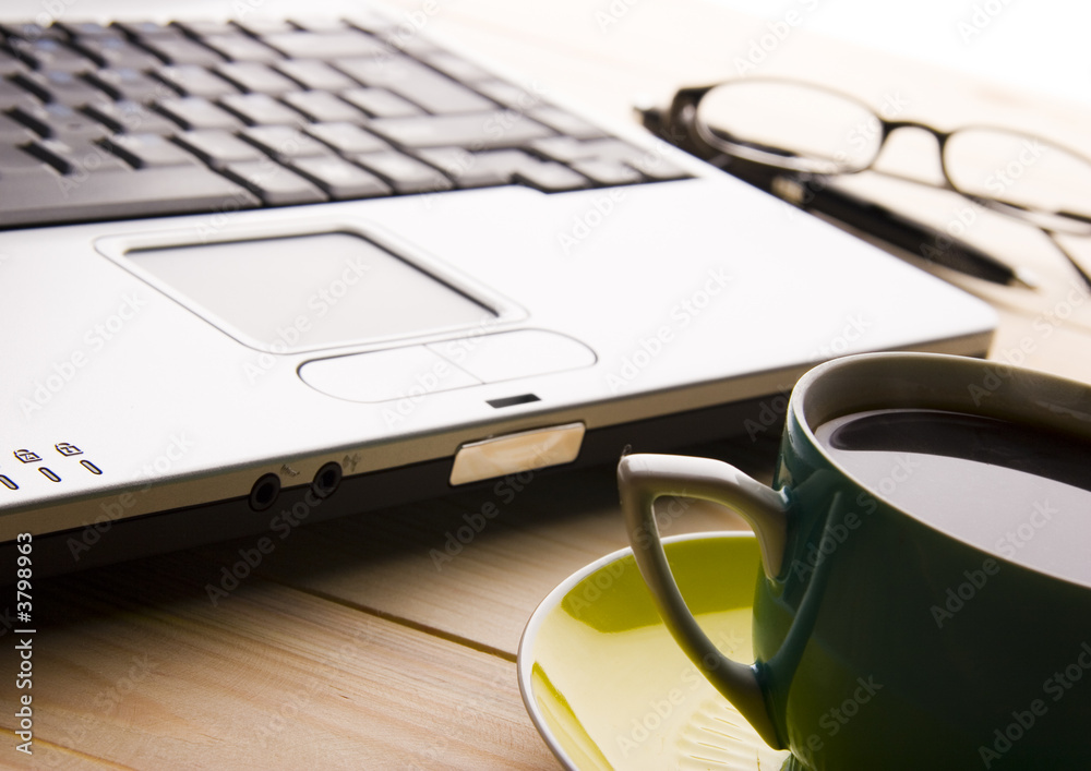 laptop and a cup of coffee laptop and a cup of coffee