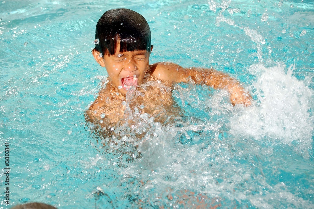 Boy Playing in a Pool