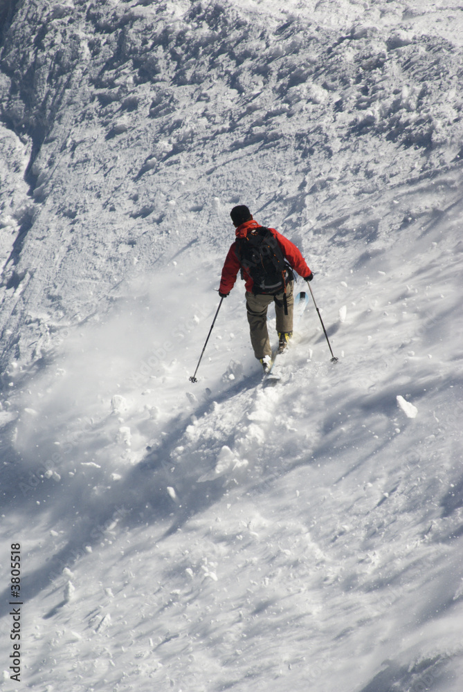 Skier on Mont Blanc mountain range viewed from Aiguille Du Midi Skier on Mont Blanc mountain range viewed from Aiguille Du Midi