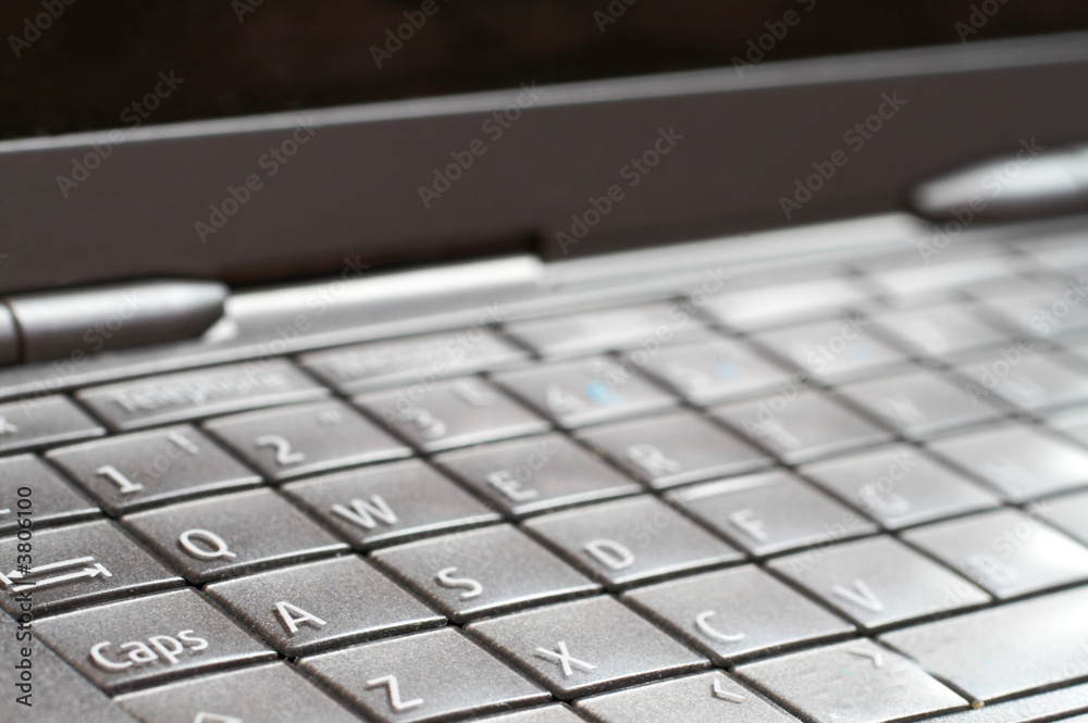 Close-up of open cellphone keyboard. Modern technology